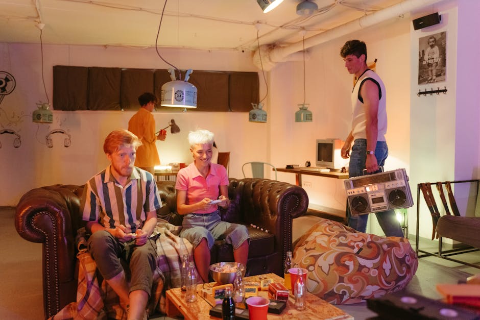 Teenagers enjoying a lively party in a retro-themed apartment with music and snacks.